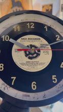 Load and play video in Gallery viewer, Jimmy Buffett &quot;Bigger Than The Both Of Us&quot; Record Clock 45rpm Recycled Vinyl
